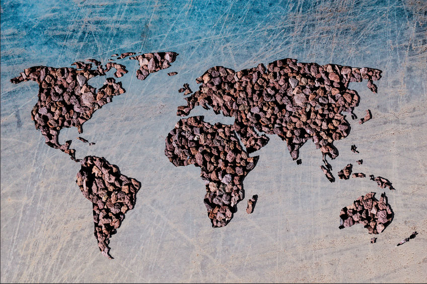 Roughly outlined world map withpebble rock background