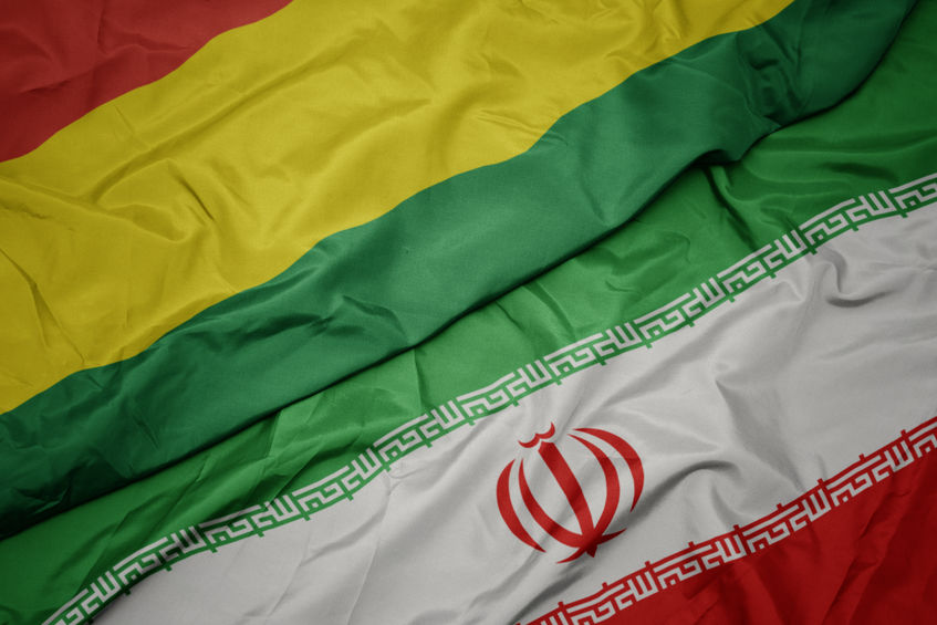 waving colorful flag of iran and national flag of bolivia.