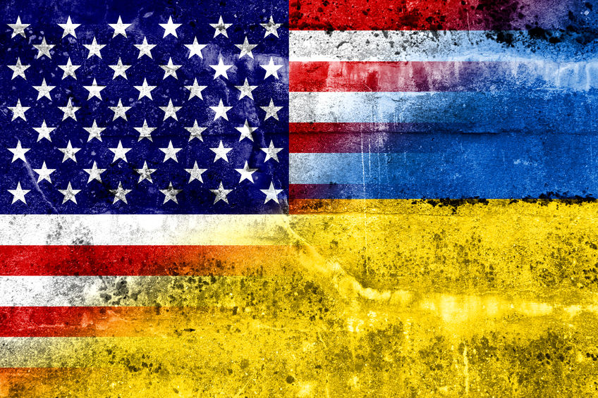 Ukraine and USA Flag painted on grunge wall