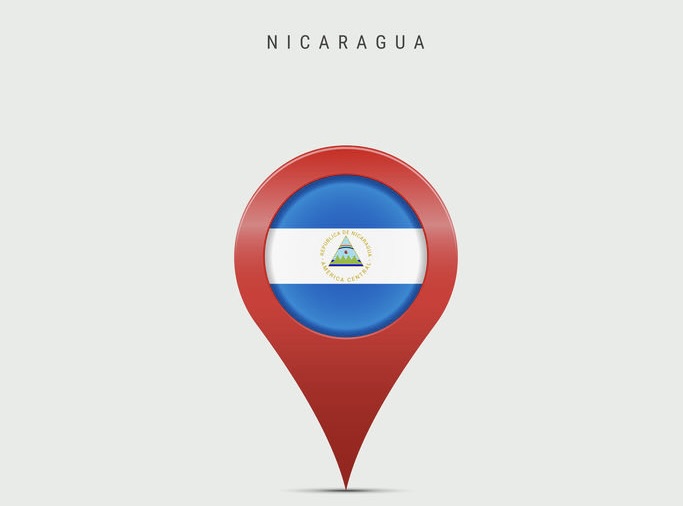 Teardrop map marker with flag of Nicaragua. 3D vector illustration