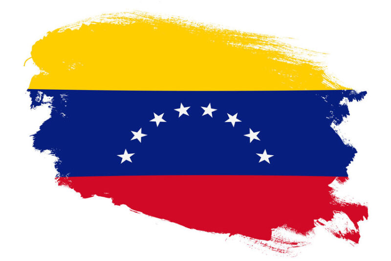 National flag of Venezuela on grunge stroke brush textured white