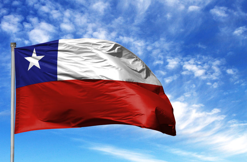 National flag of Chile on a flagpole in front of blue sky