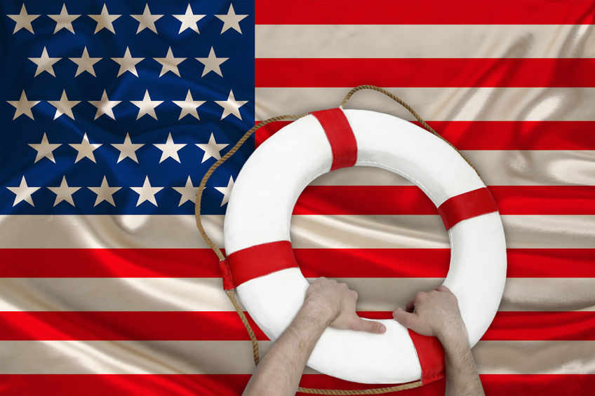 male hands hold on a life buoy against the backdrop of the silk national flag of the USA country, concept of medical insurance, tourism, disaster