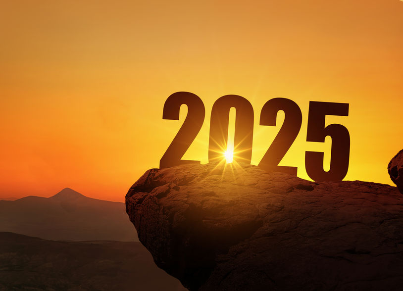 New Year 2025 at sunset. Silhouette 2025 stands on a mountain wi