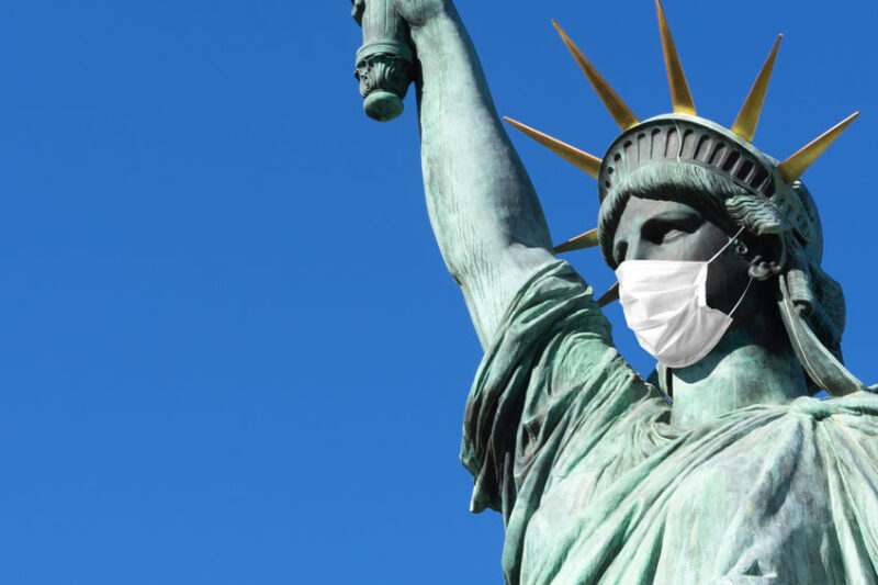 Statue of Liberty in a medical mask. Concept pandemic in the U