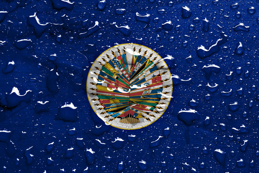 flag of Organization of American States with rain drops